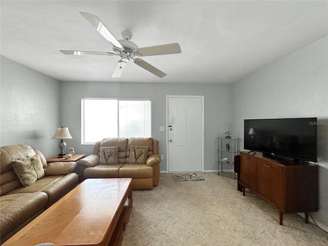 living room with light colored carpet, baseboards, and a ceiling fan