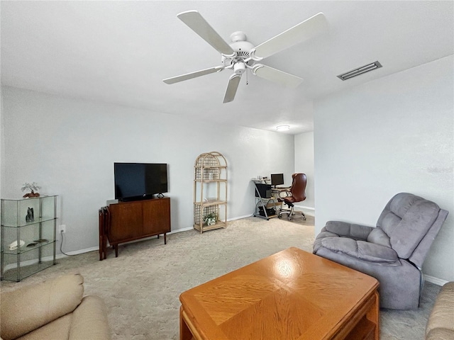 living room with visible vents, baseboards, ceiling fan, and carpet flooring