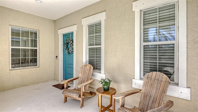 property entrance featuring stucco siding