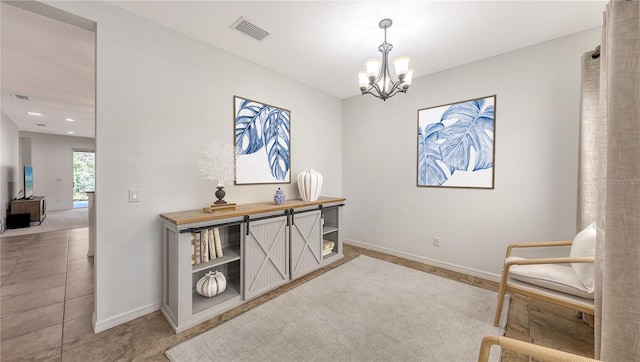 living area with an inviting chandelier, light tile patterned floors, baseboards, and visible vents