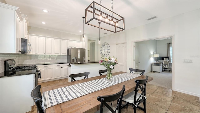 dining room with light tile patterned flooring, recessed lighting, visible vents, and baseboards