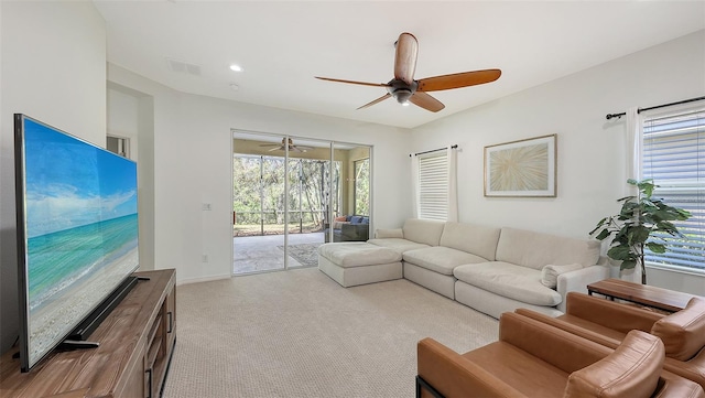 carpeted living room with recessed lighting, visible vents, baseboards, and ceiling fan