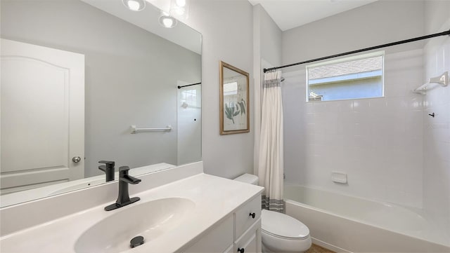 bathroom featuring vanity, toilet, and shower / bathtub combination with curtain