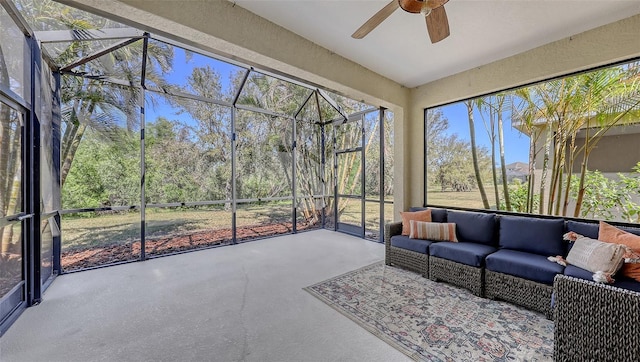 sunroom / solarium featuring ceiling fan