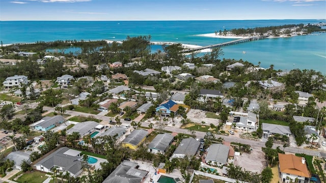 birds eye view of property with a water view and a residential view