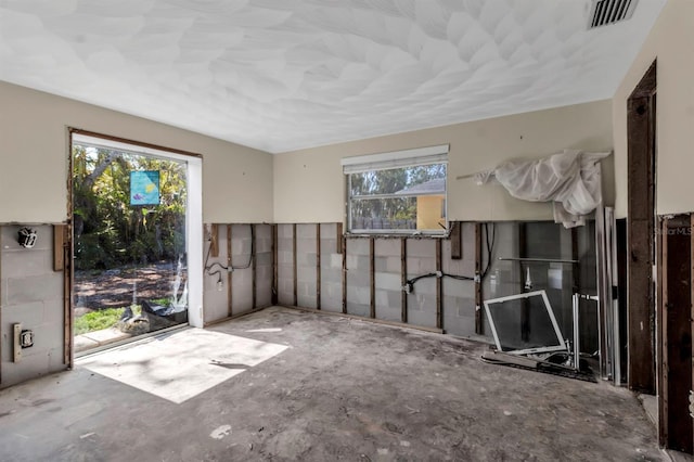 entryway with visible vents and concrete floors