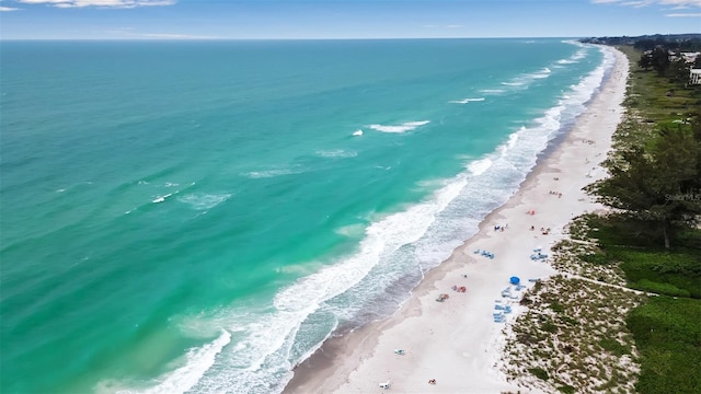 aerial view with a view of the beach and a water view