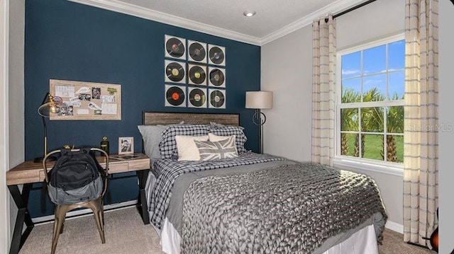 carpeted bedroom featuring baseboards and ornamental molding