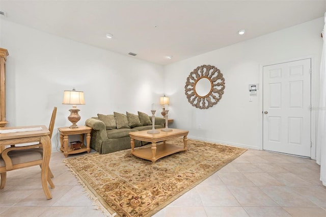 living room featuring light tile patterned floors, visible vents, recessed lighting, and baseboards