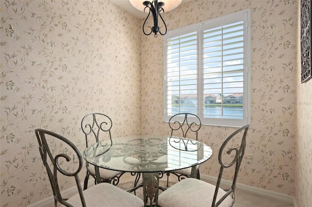 dining room with baseboards, plenty of natural light, and wallpapered walls