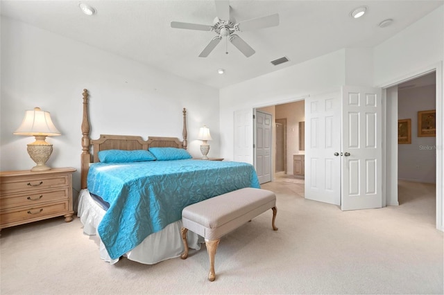 bedroom with a ceiling fan, visible vents, recessed lighting, light colored carpet, and connected bathroom