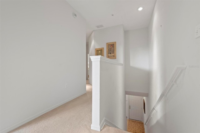 staircase featuring recessed lighting, visible vents, baseboards, and carpet