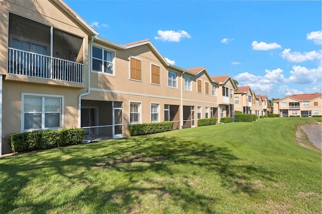 view of community with a residential view and a lawn