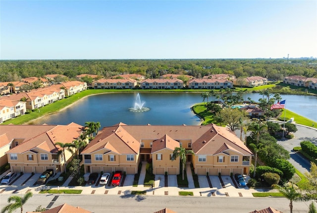 bird's eye view with a residential view and a water view