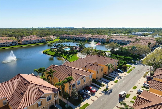 aerial view featuring a residential view and a water view