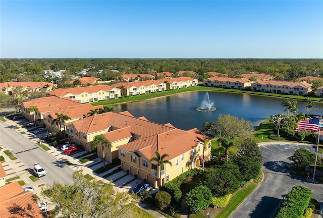 aerial view with a residential view and a water view