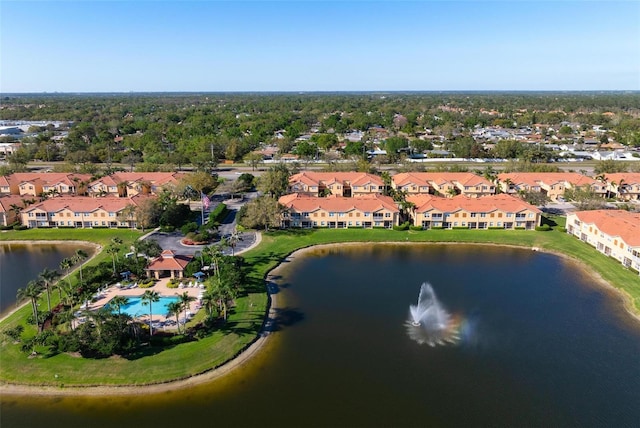 birds eye view of property featuring a residential view and a water view