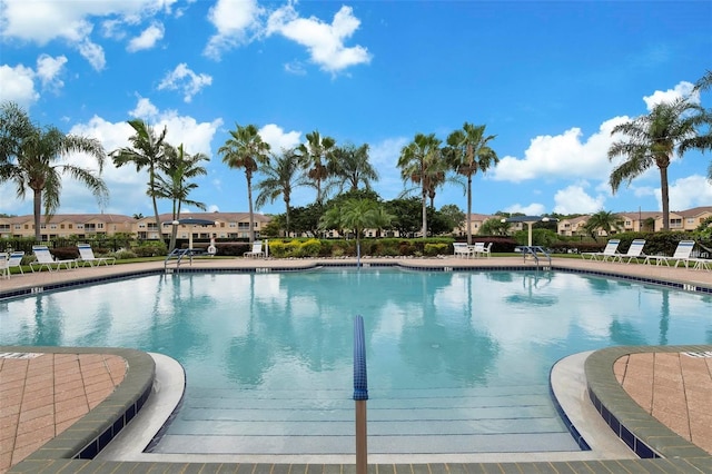 community pool with a residential view