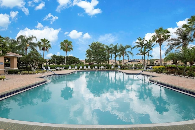 community pool with a patio area