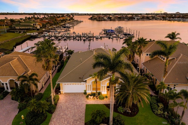 aerial view at dusk with a water view