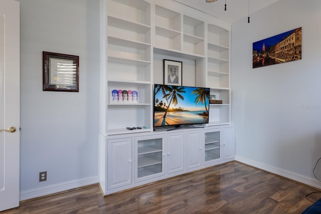 1009 3rd St E, Palmetto, FL 34221 - unfurnished living room with dark wood finished floors and baseboards