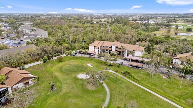 birds eye view of property with view of golf course and a residential view