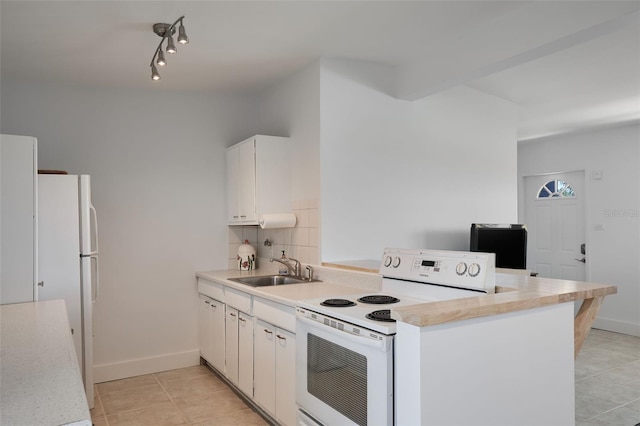 kitchen with white appliances, a sink, light countertops, white cabinets, and backsplash