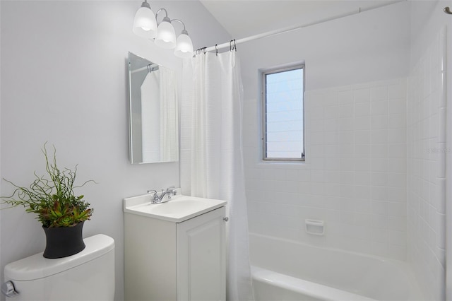 bathroom with vanity, toilet, and shower / bath combo