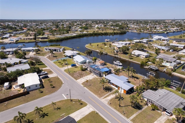 bird's eye view featuring a residential view and a water view