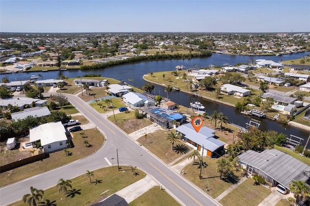 birds eye view of property featuring a residential view and a water view