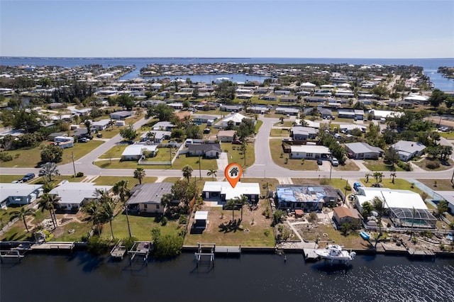 bird's eye view featuring a residential view and a water view