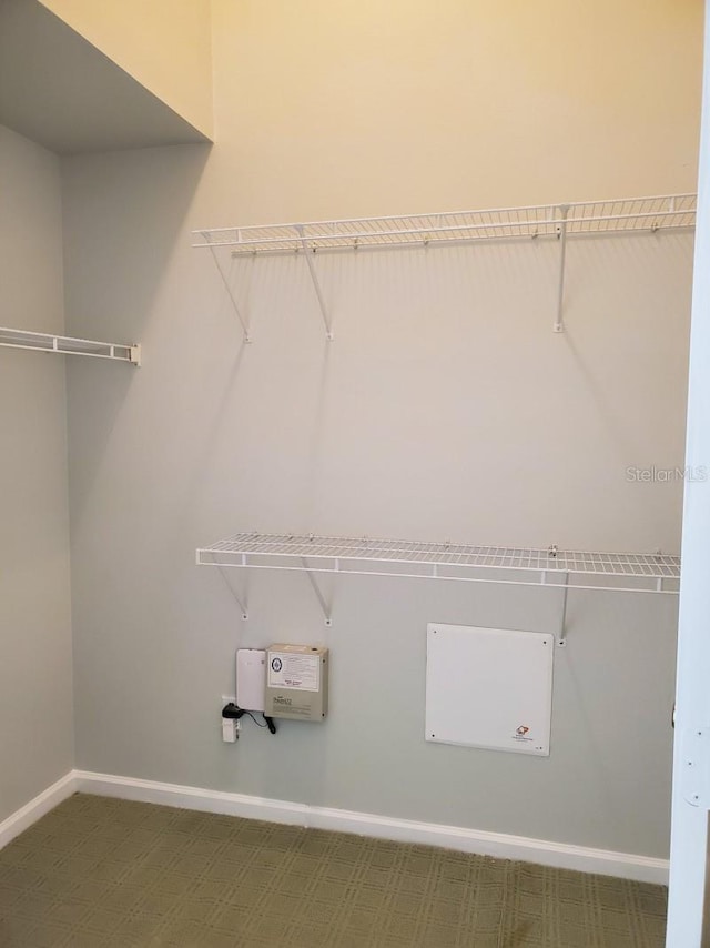 laundry area featuring baseboards, carpet, and hookup for a washing machine