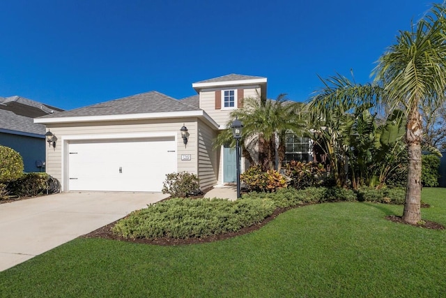 view of front of home with a garage, roof with shingles, concrete driveway, and a front lawn