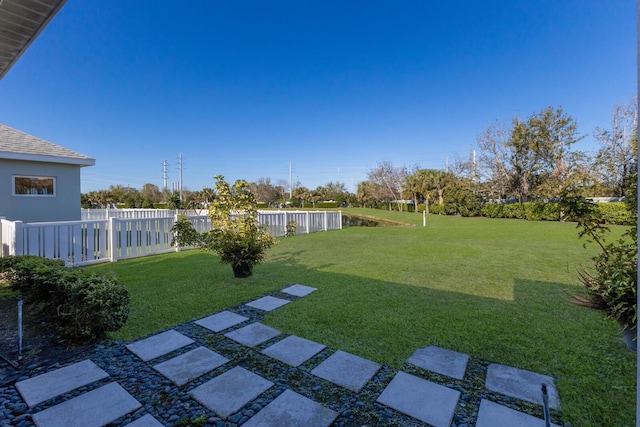 view of yard with a fenced backyard