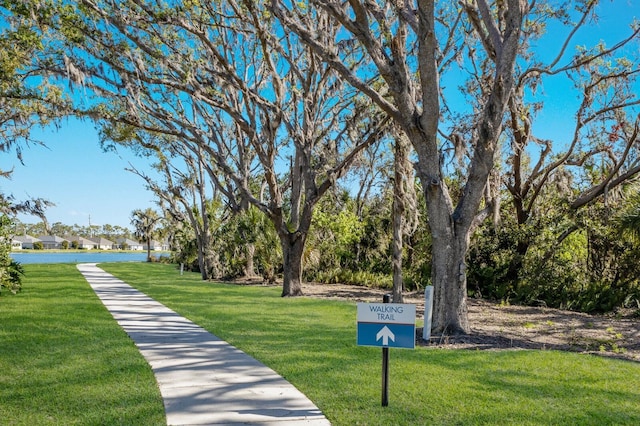 view of home's community featuring a lawn