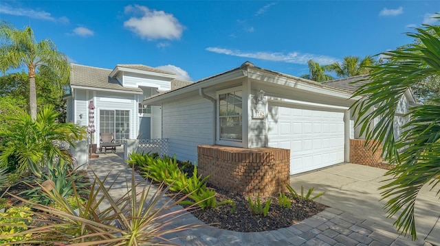 view of side of home featuring a garage