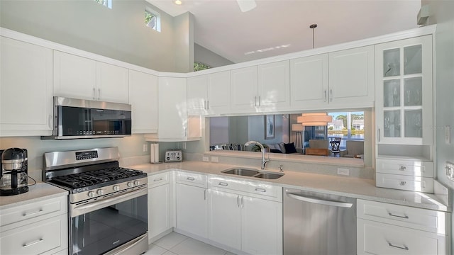 kitchen featuring a sink, appliances with stainless steel finishes, and light countertops