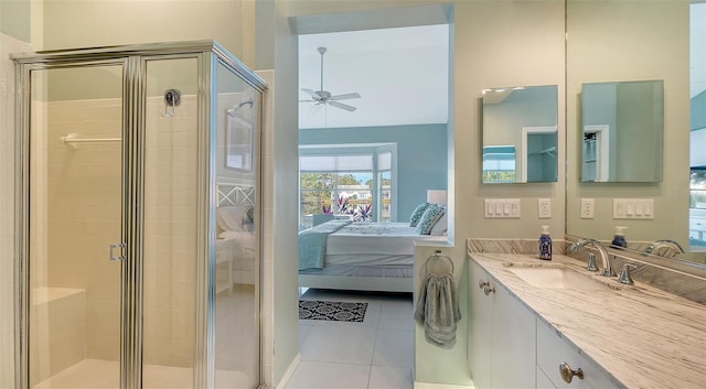 ensuite bathroom with a stall shower, ensuite bath, tile patterned flooring, ceiling fan, and vanity