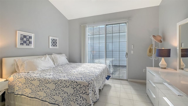 bedroom with light tile patterned floors, baseboards, access to outside, and vaulted ceiling