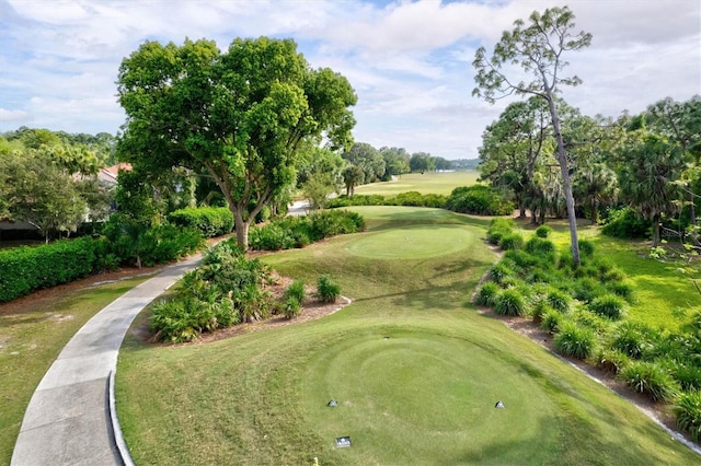 view of property's community with view of golf course