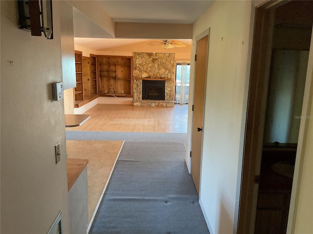 hall featuring built in features and wood finished floors