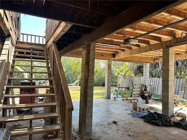 view of patio / terrace with stairs and fence