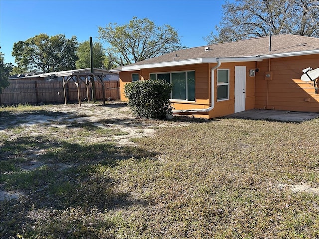 back of property with fence