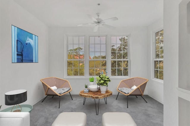 sunroom featuring plenty of natural light and a ceiling fan