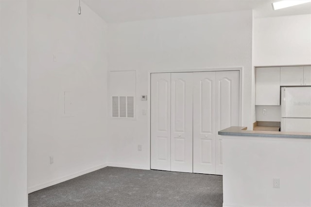 interior space featuring baseboards and visible vents