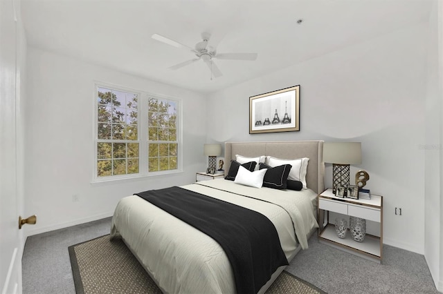 carpeted bedroom with ceiling fan and baseboards