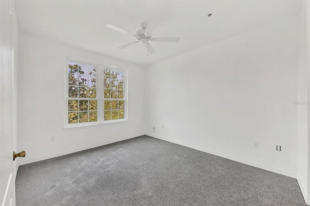 unfurnished room with baseboards, carpet floors, and ceiling fan