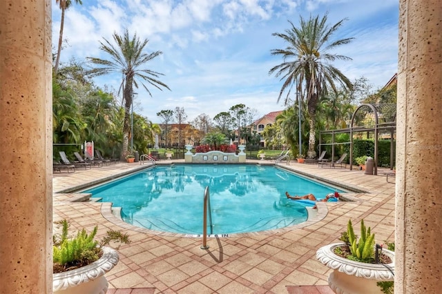 pool with a patio area