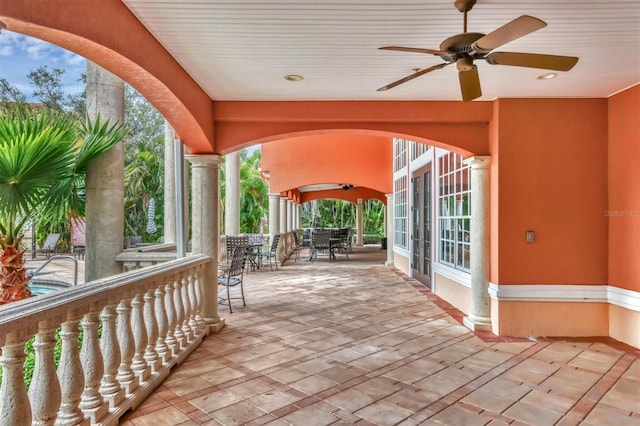 view of patio / terrace with french doors, outdoor dining area, and ceiling fan