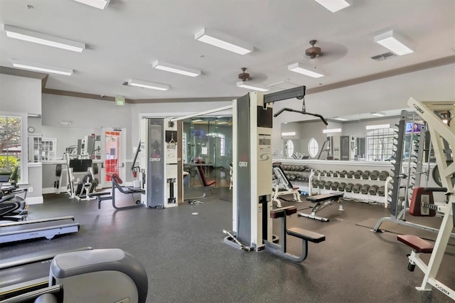 exercise room featuring baseboards and a ceiling fan